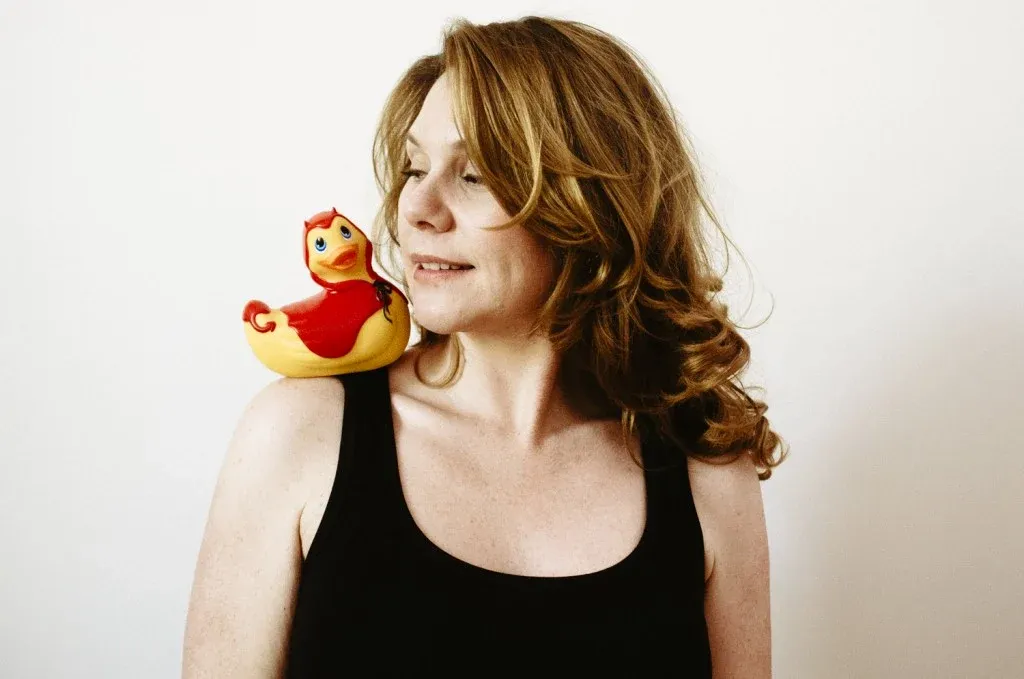Erika Lust with red and yellow rubber ducky on her shoulder 