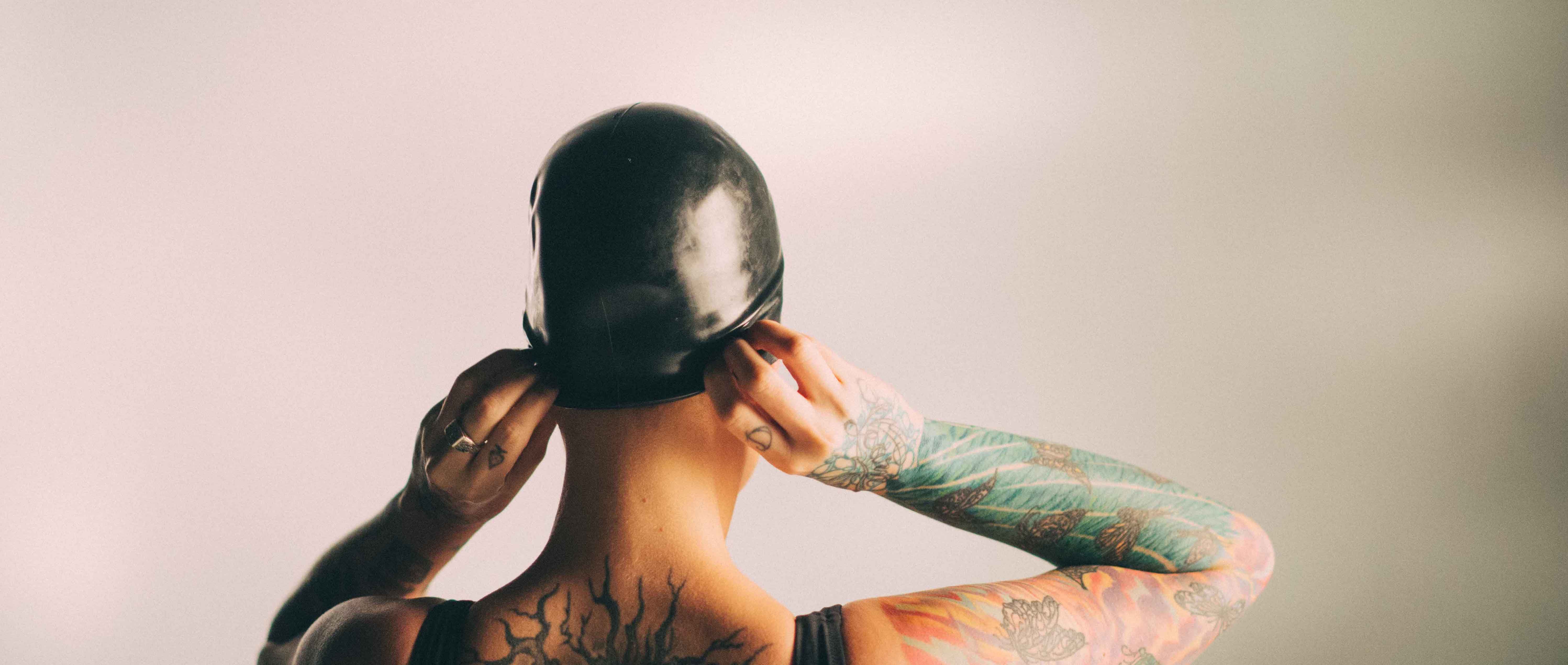 Film still from explicit latex fetish film Rubber Feel