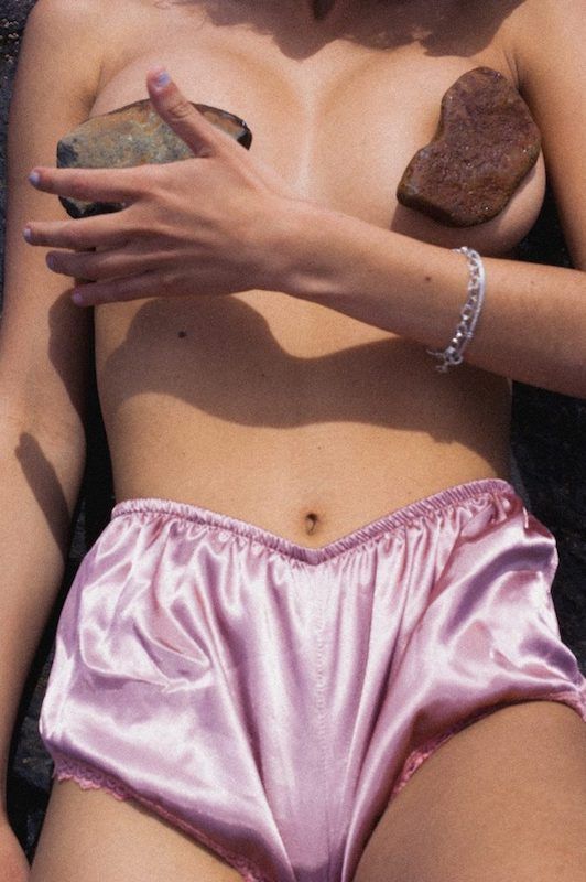 Image of a woman on the beach by Maty Chevrière