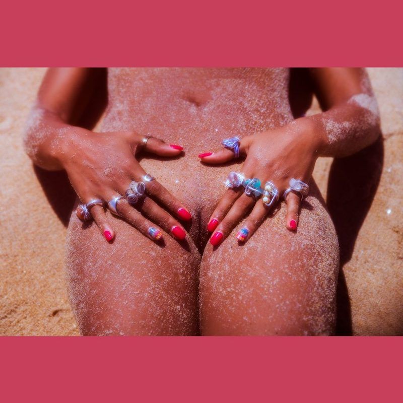 Photo of a naked woman covered in sand by Massalo