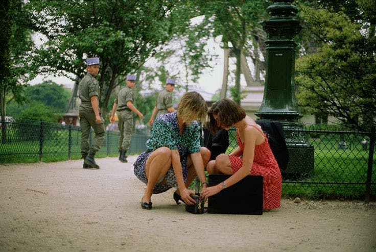 Roy Stuart's Glimpse 15 erotic film two woman kneeling in a park