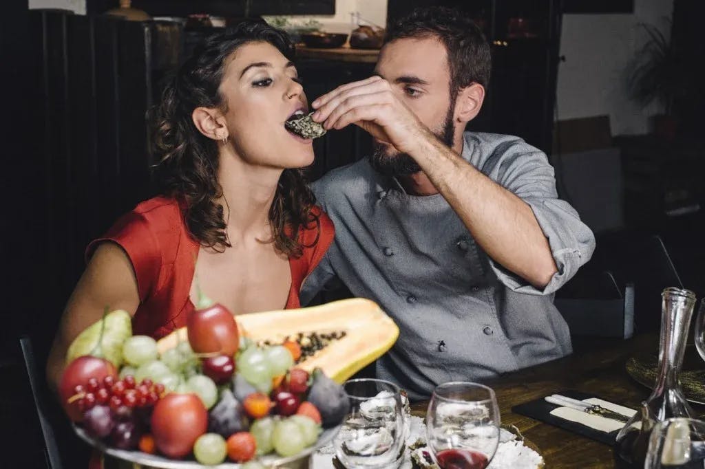 Marc Morato feeding Julia Roca in the erotic film Eat With...Me
